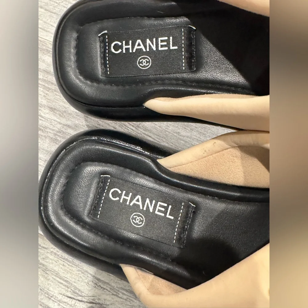 Chanel beige black Rev criss cross puffy CC logo slide sandals
